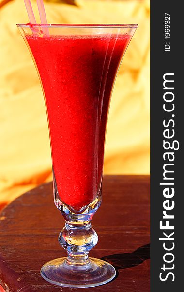 Red Strawberry Smoothie in a tall glass