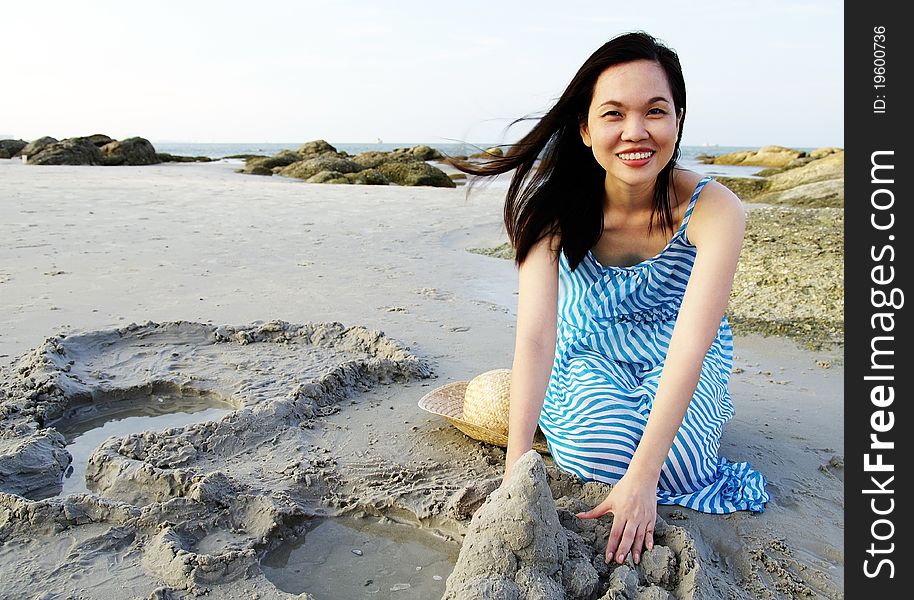 Portrait of young woman playing on the beach. Portrait of young woman playing on the beach