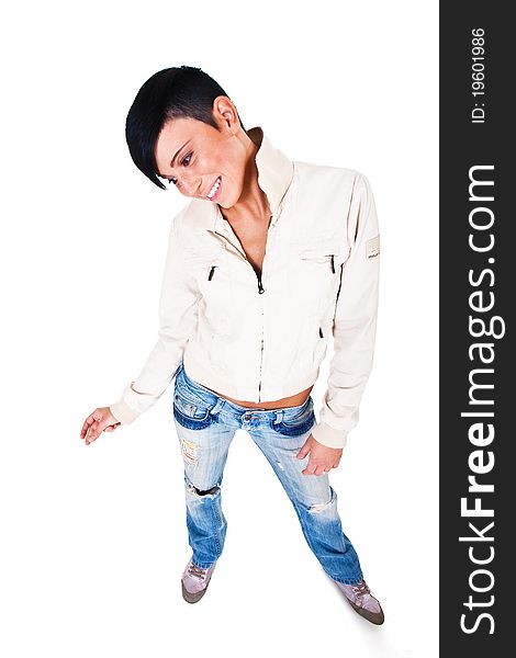 Beautiful short haired young Caucasian woman in blue jeans, over white background