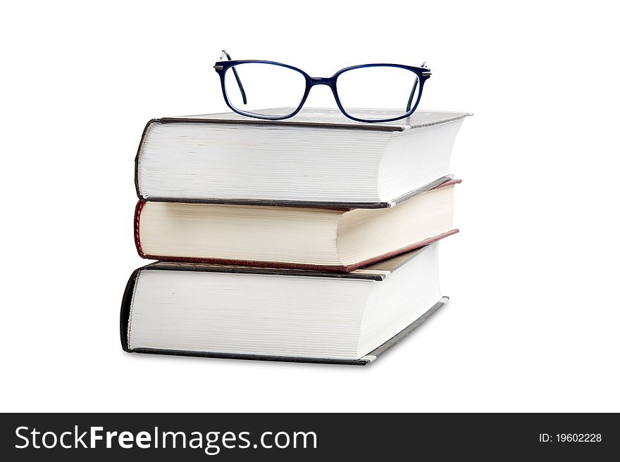 Book stack with eye glasses. Book stack with eye glasses