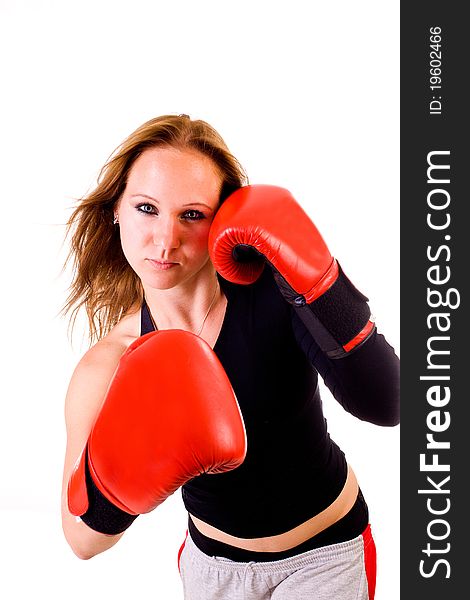 Attractive Caucasian girl practicing boxing, isolated on white background