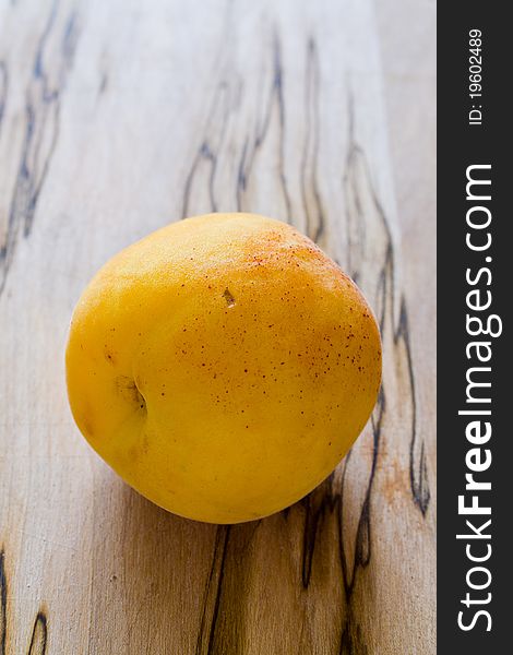 Closeup of apricot on wood table