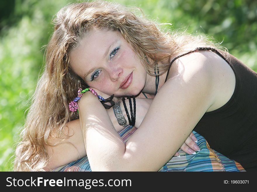 Young attractive woman on natural background