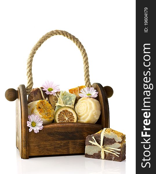 Composition of the basket full of handmade soap, isolated on white background. Composition of the basket full of handmade soap, isolated on white background.