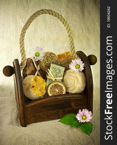 Composition of the basket full of handmade soap with some flower decoration. Composition of the basket full of handmade soap with some flower decoration.