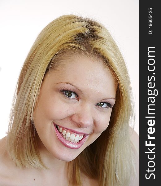 Young blond woman with wide smile, Neutral make up. Young blond woman with wide smile, Neutral make up