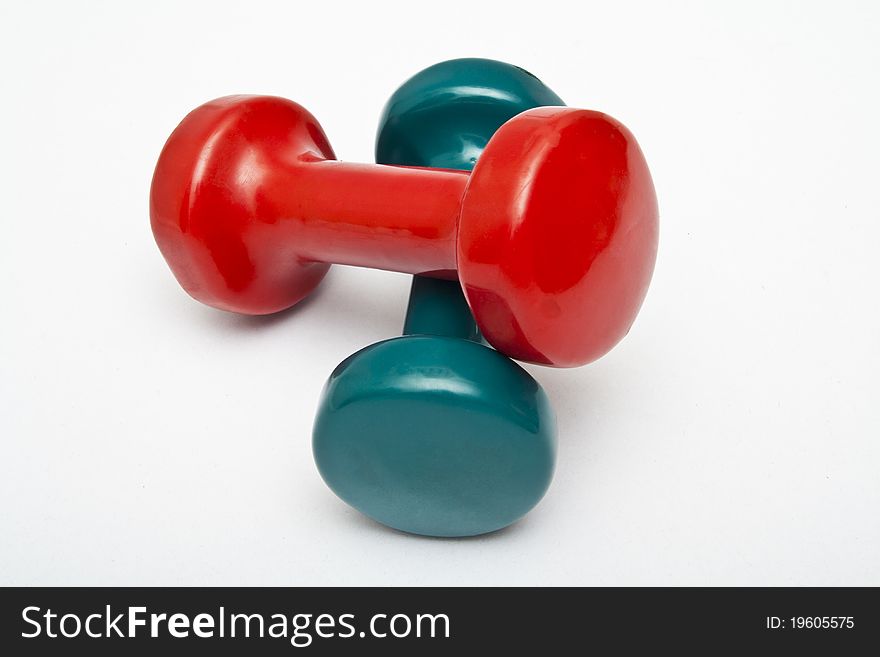 Red and green dumbbells hand weight.