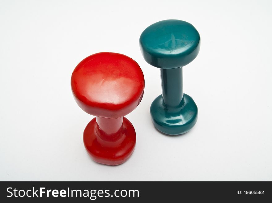 Red and green dumbbells hand weight.
