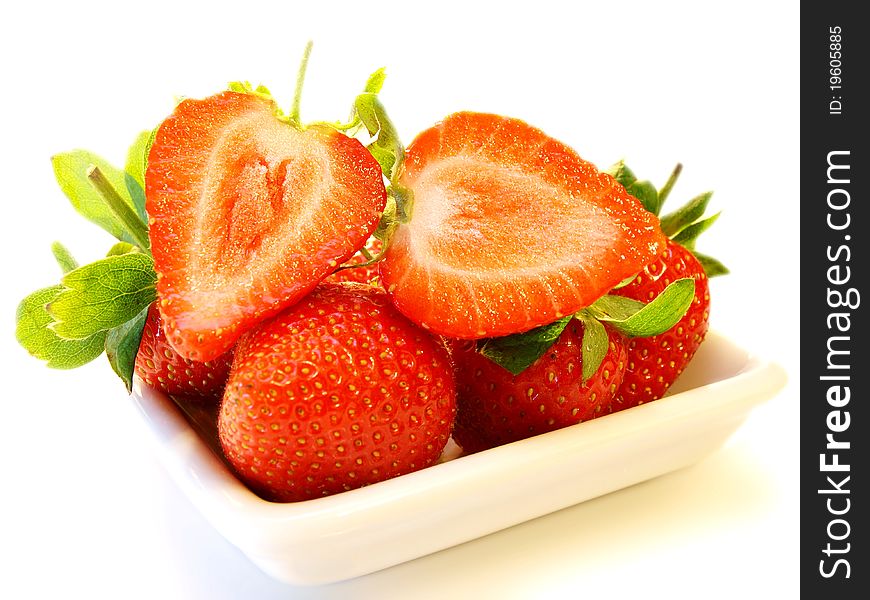 Strawberry fruit, on white plate isolated towards white background