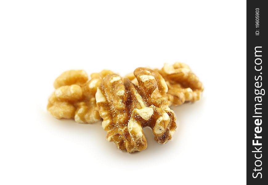 Walnuts in a pile isolated towards white background. Walnuts in a pile isolated towards white background