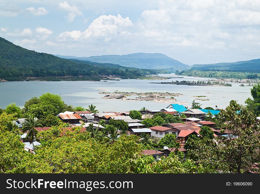 Small Village beside the River and blue sky,Countryside of Thailand