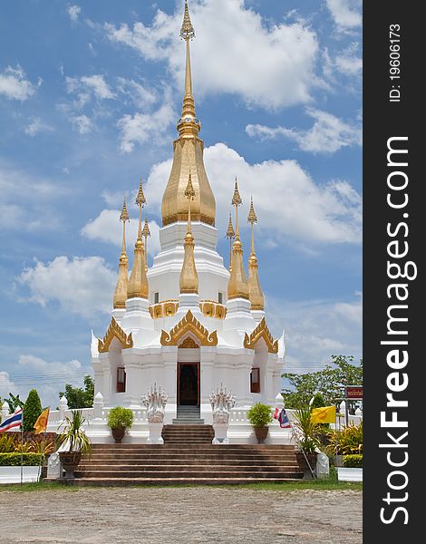 Golden Pagoda and blue sky in Wat Tham Khuha Sawan,Ubonratchathanee Province, Thailand.