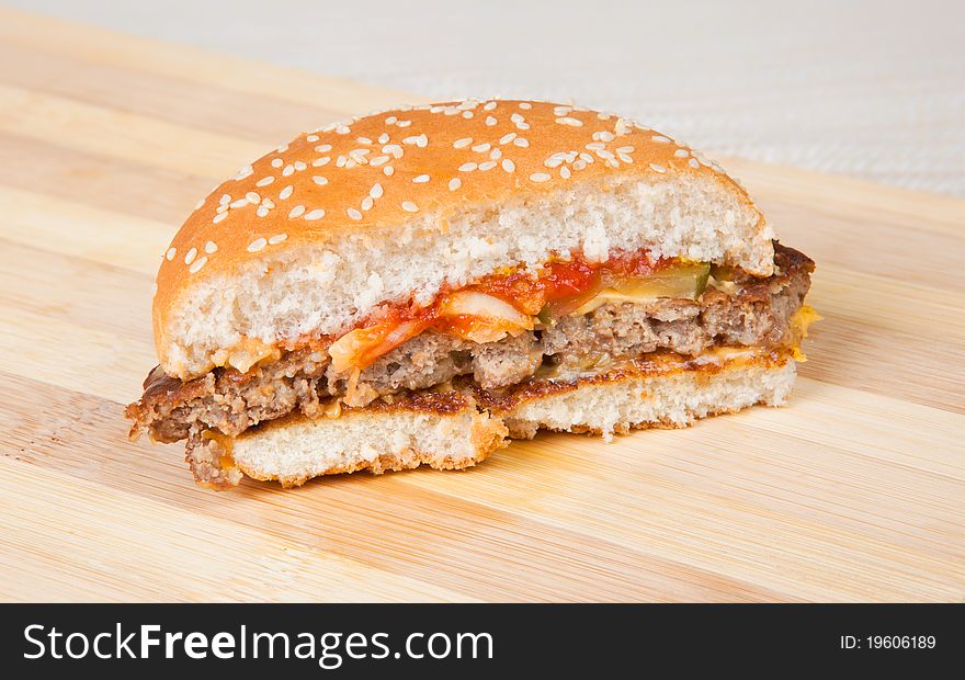 Delicious hamburger with lots of cheddar