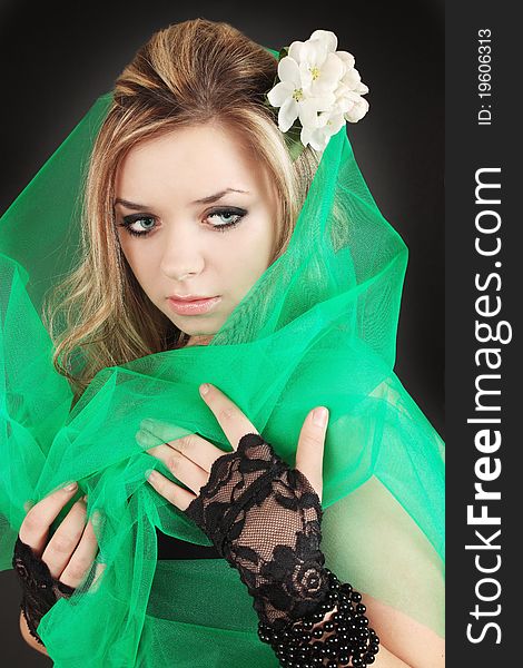 Girl with the flower in the green the veil. Girl with the flower in the green the veil