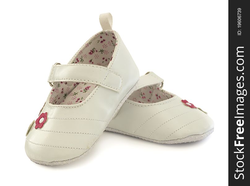 Adorable white baby shoes with floral patterns