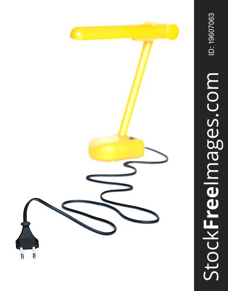 Electric plug with long black cable and yellow desk lamp on white background. Electric plug with long black cable and yellow desk lamp on white background