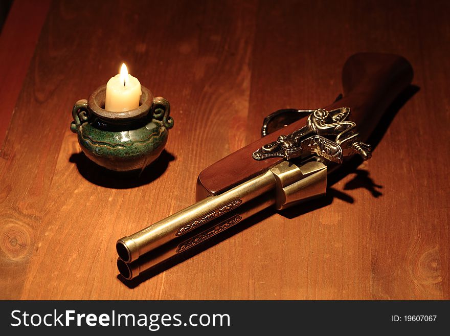 Ancient Pistol And Candle