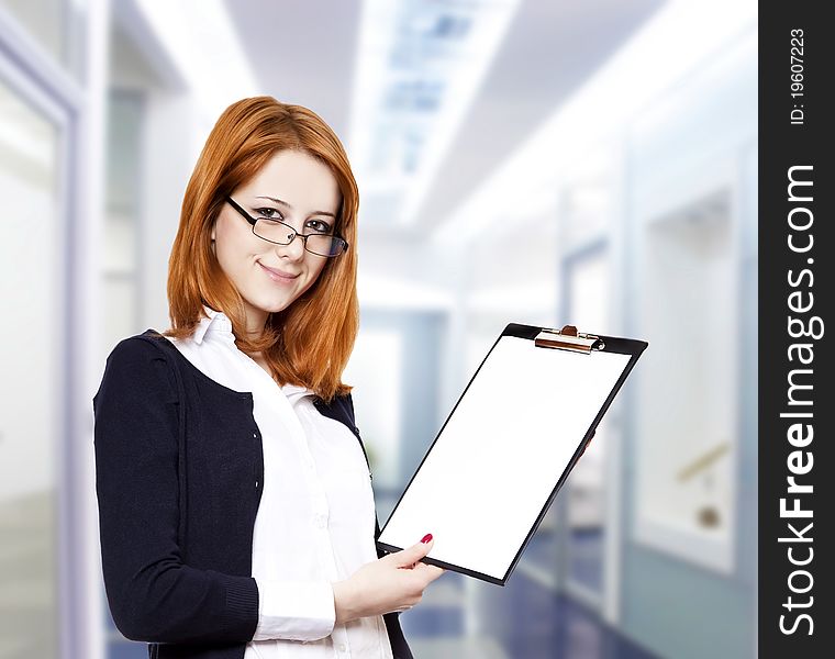 Portrait of the business woman with a represent folder. Studio shot.