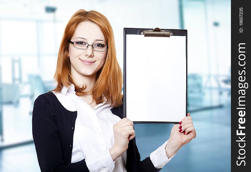 Portrait of the business woman with a represent folder. Studio shot.