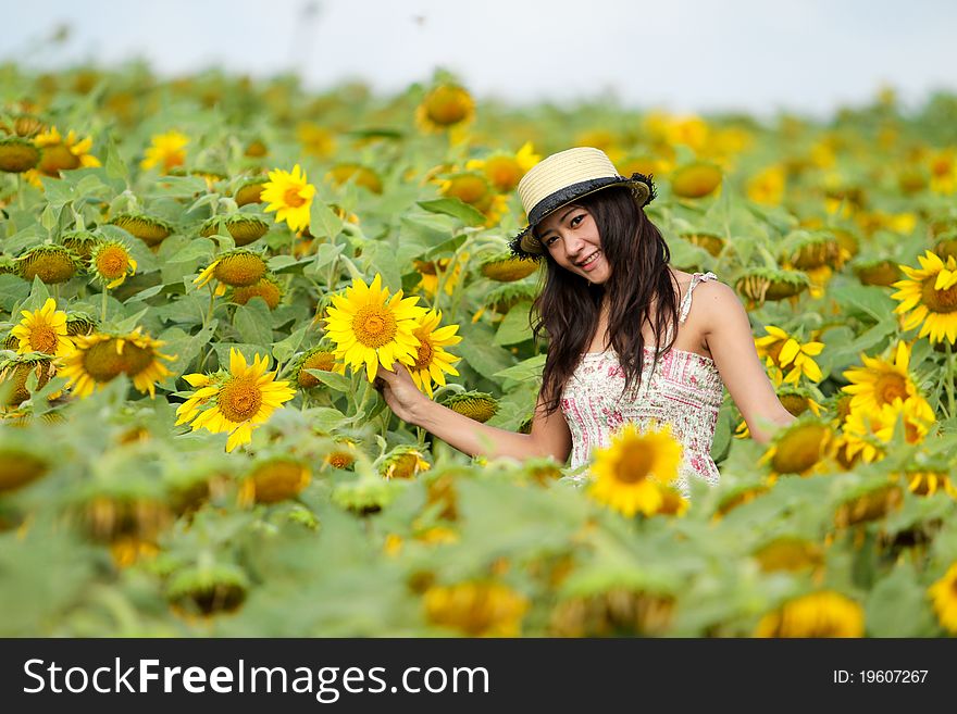 Happy Girl Between Sunflower