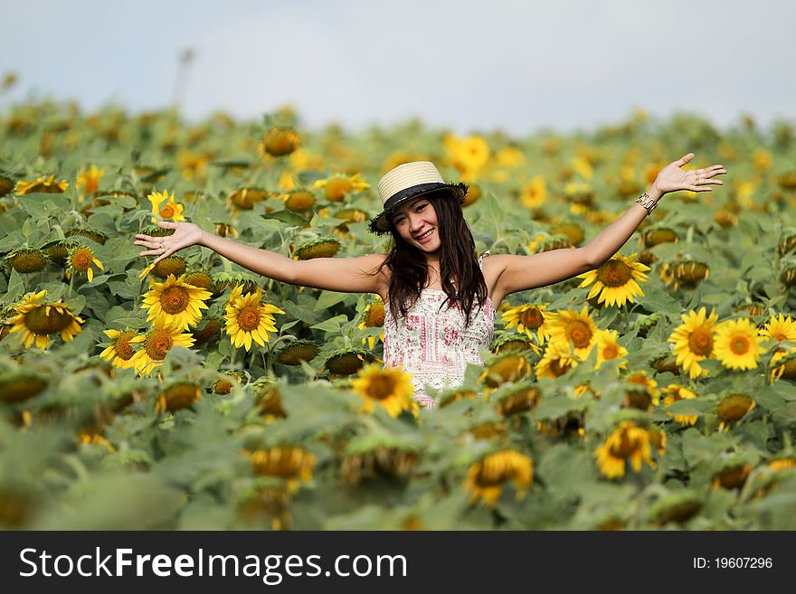Fun Woman In The Field Of Sunflowers