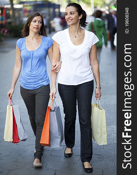 Two women with bags shopping. Two women with bags shopping