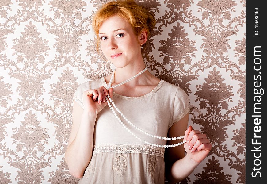 A beautiful smiling woman with beads