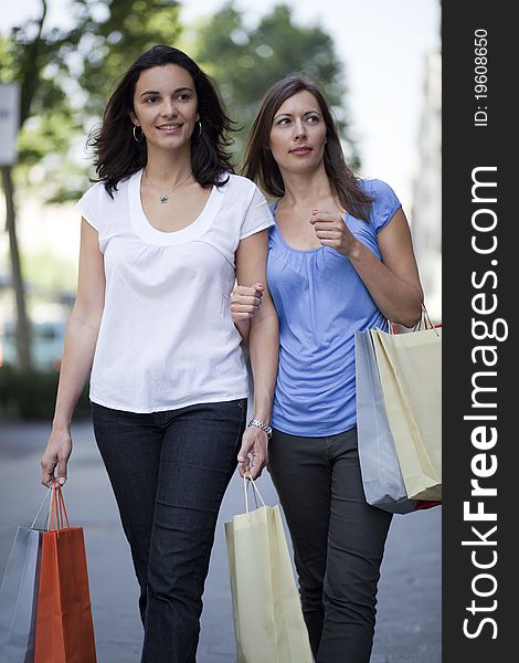 Two women with bags shopping. Two women with bags shopping