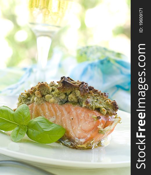 A grilled salmon fillet with basil  and wine