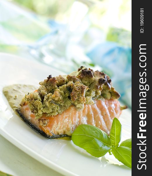 A grilled salmon fillet with basil and wine