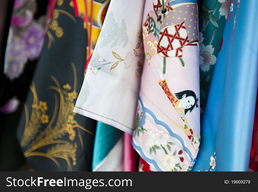 Many different and colourful Kimonos at a market in Japan.