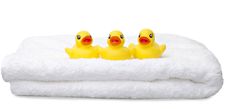Three Yellow Rubber Ducks In A Row Stock Images