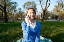 Girl Talking With A Cell In The Park Stock Image