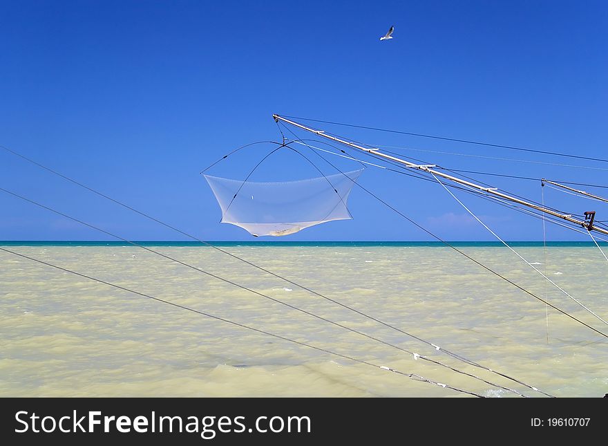 Fishing net at sea with clear blue sky