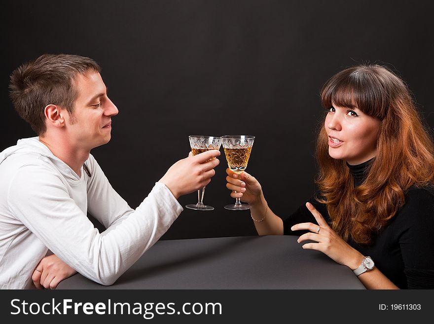 Couple at the table with glasses of wine. Couple at the table with glasses of wine