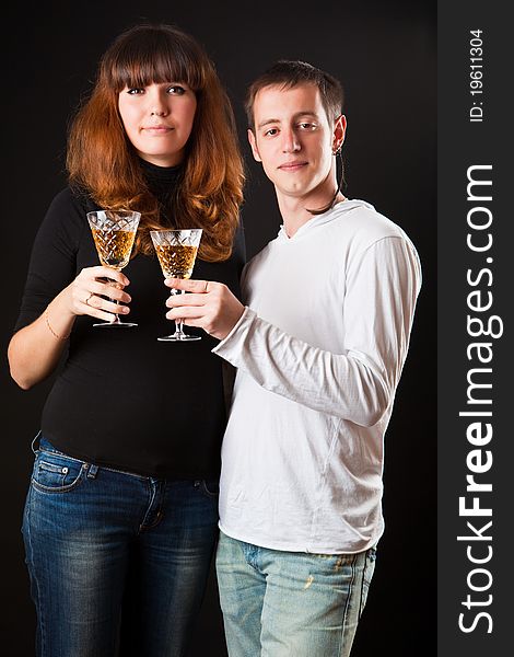 Couple of glasses of wine on a black background. Couple of glasses of wine on a black background