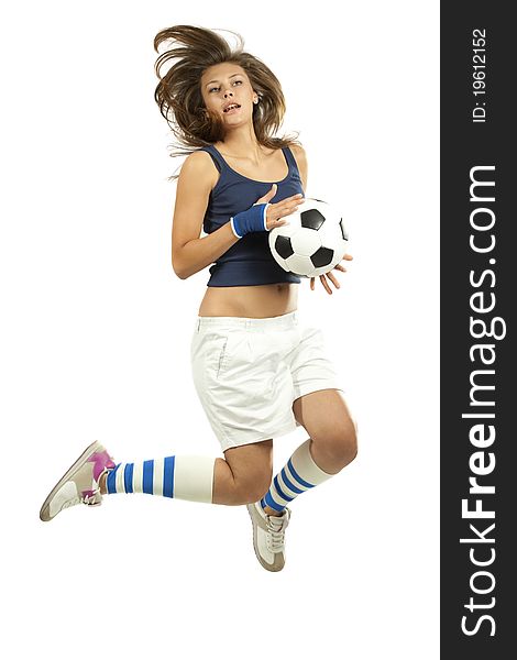 Girl jumpig with soccer ball in mid air with over white background