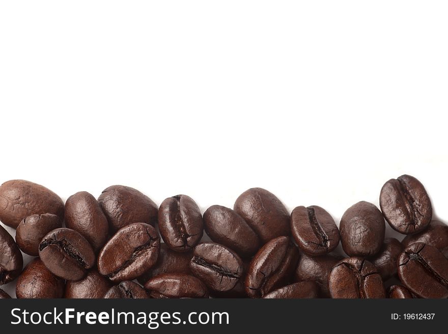 Coffee beans close up in isolated white background