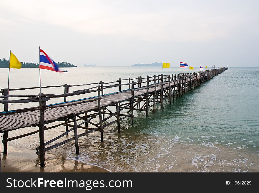 Wooden walk way to sea port south of Thailand