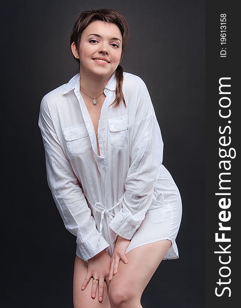 Young brunette woman posing in white shirt. Young brunette woman posing in white shirt