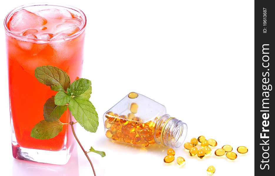 Concept image of healthy diet juice and vitamin pills.