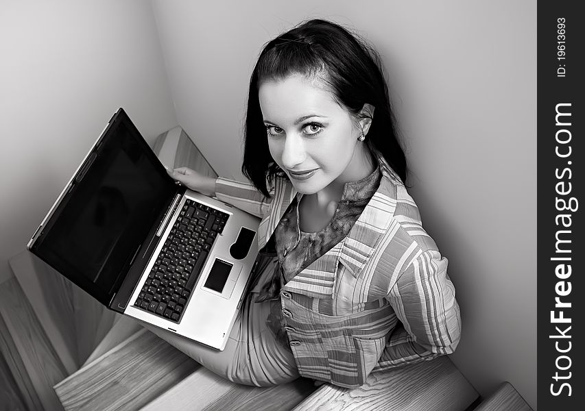 Young woman sitting on stairs with laptop. Young woman sitting on stairs with laptop