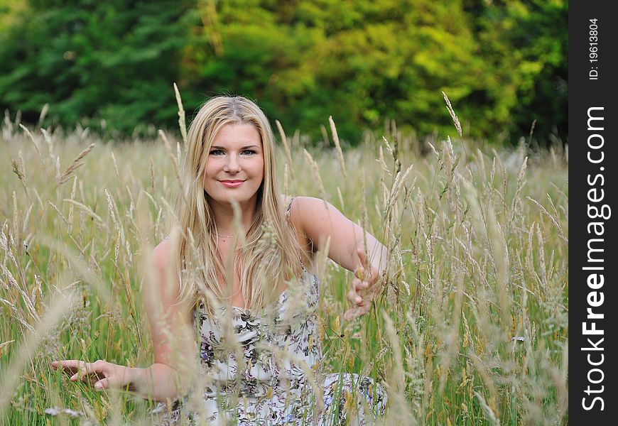 Pretty Summer Woman On Yellow Wheat Field