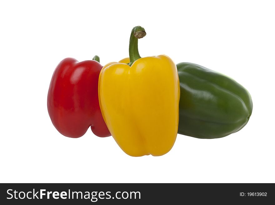One red, one yellow and one green pepper. One red, one yellow and one green pepper