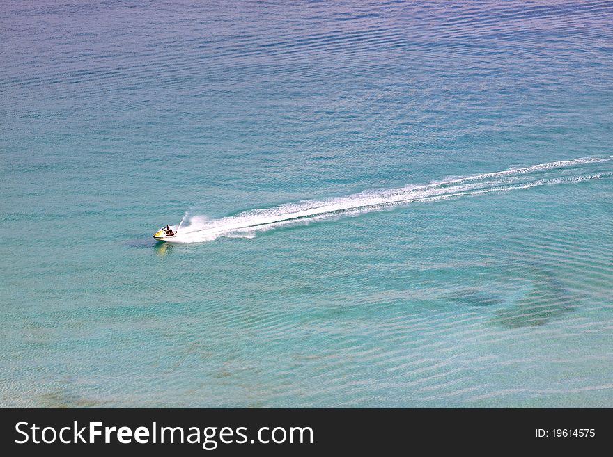 Ride a jet ski in the sea.