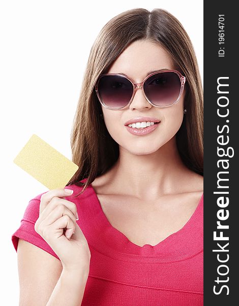 Young girl in sunglasses with a credit card on a white background. Young girl in sunglasses with a credit card on a white background