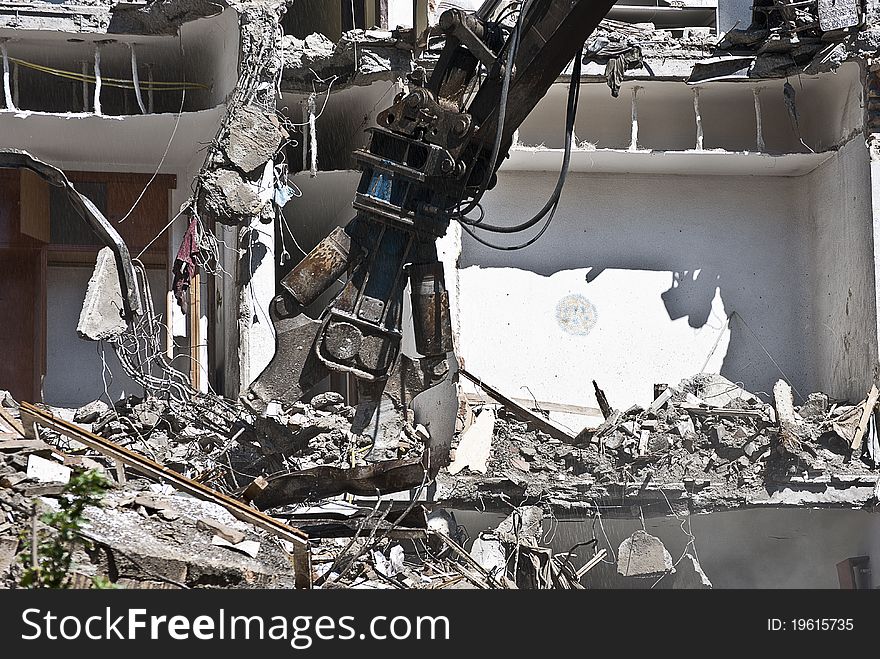 Indrustrial machine demolishing a building