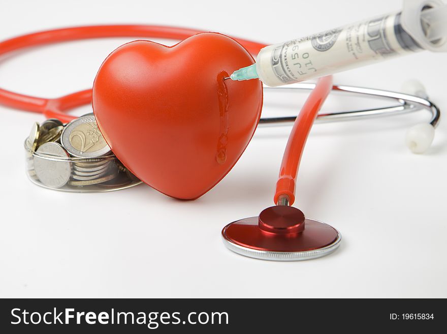 Healthcare cost money coins and bills with a red stethoscope and blood drop. Healthcare cost money coins and bills with a red stethoscope and blood drop