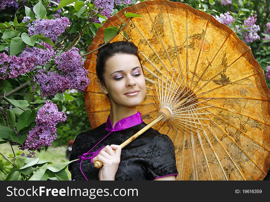 Portrait of an asian style woman in lilac