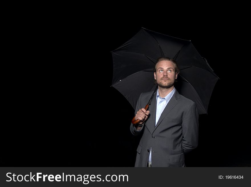Man in suit with black umbrella. Man in suit with black umbrella
